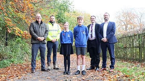 Cllr Jon London standing on the new path